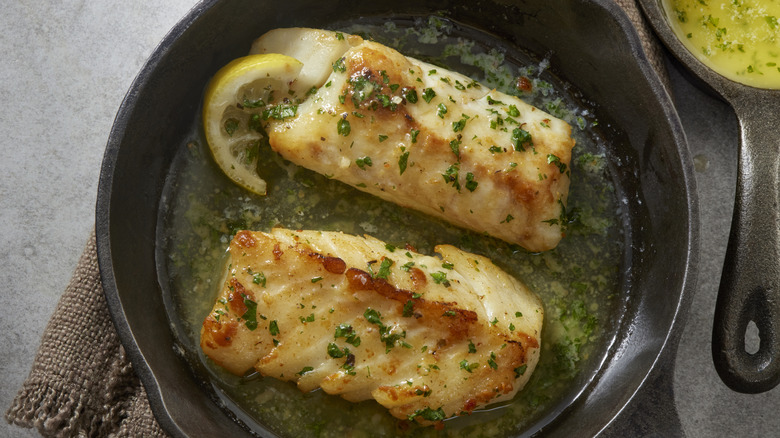 Pan seared cod loins cooked in garlic lemon butter