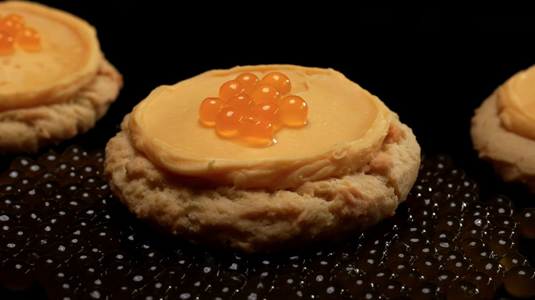 Passion Fruit Crumbl cookie on passion fruit boba pearls