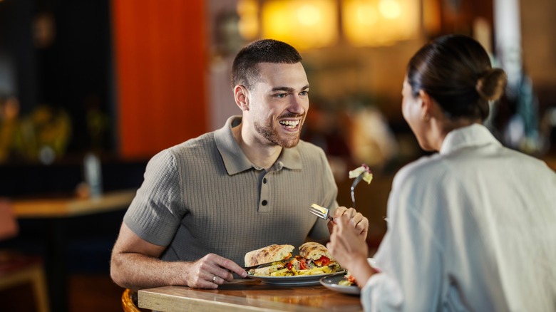 two friends dine out at a casual eatery