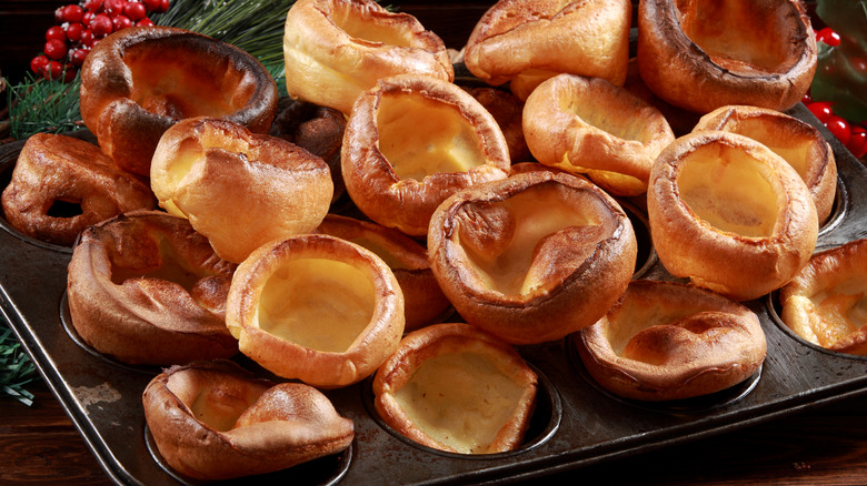 Several small Yorkshire puddings on a muffin pan
