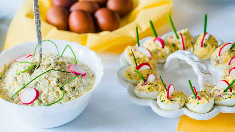 bowl of potato salad and tray of deviled eggs