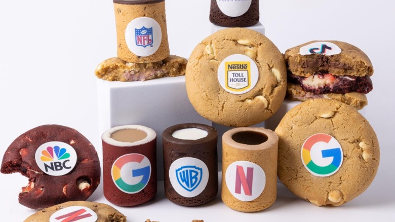 Dirty Cookie products with corporate logos, white background