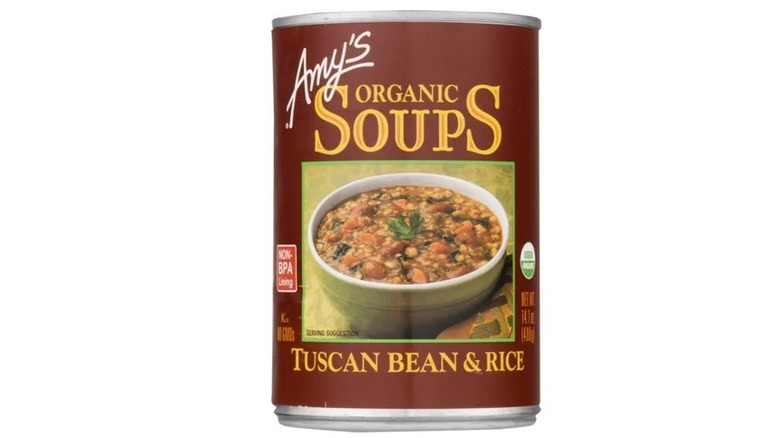 A can of Amy's Kitchen Tuscan bean and rice soup on a white background