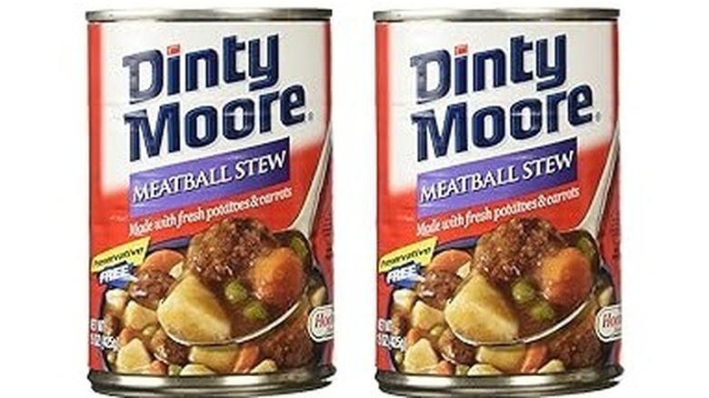 Two cans of Dinty Moore meatball stew, side by side on a white background
