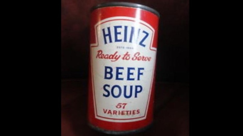 A photo of a can of Heinz Beef soup on a dark background