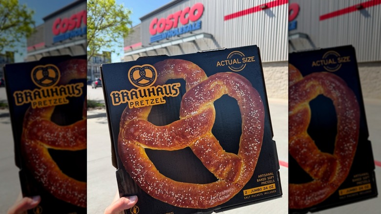 Someone holding a box of Brauhaus soft pretzels