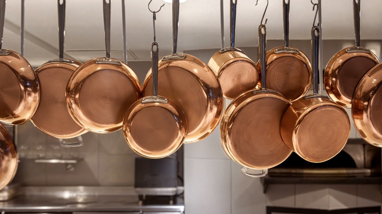 hanging pots and pans in kitchen