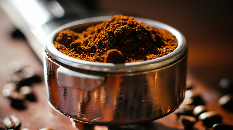 coffee grounds in measuring utensil
