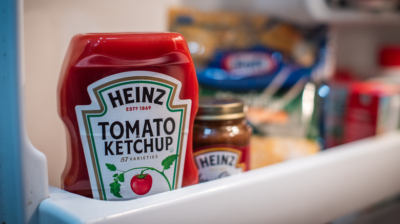 Ketchup on a shelf in refrigerator