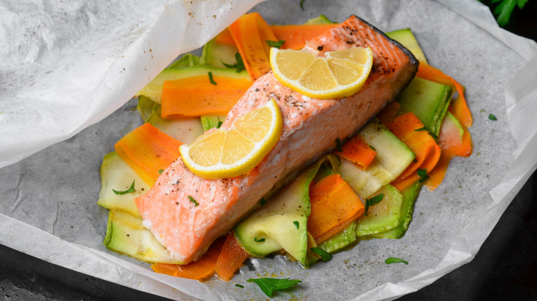 Salmon baked in parchment paper with vegetables