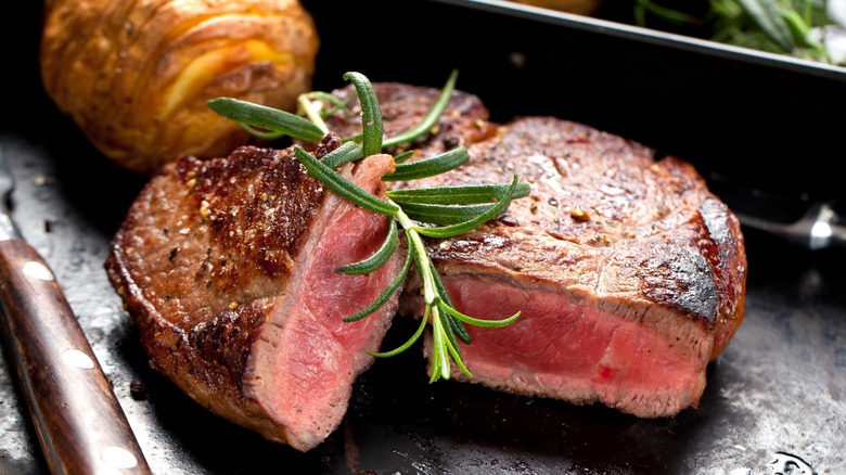 A perfectly grilled steak cut in half