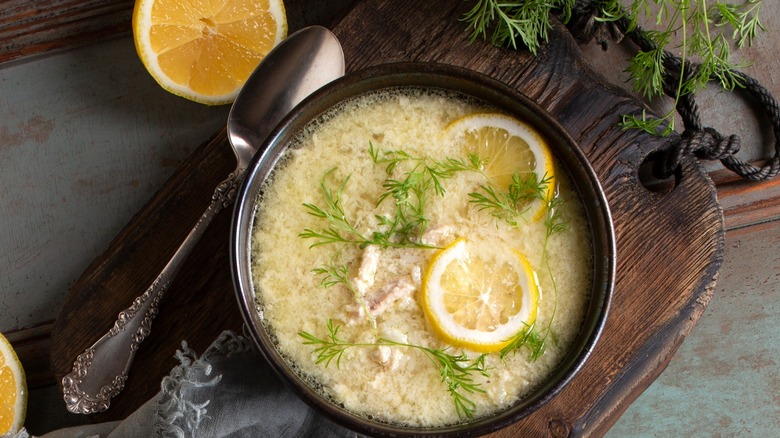chicken soup with slices of lemon