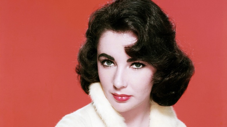 elizabeth taylor with red background and white fur