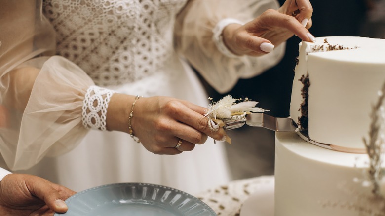 cutting a wedding cake