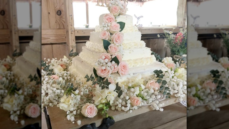A rose-covered wedding cake made from Costco custom cakes