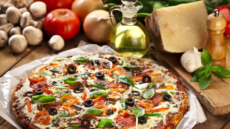 Pizza with mushrooms, cheese, and tomatoes