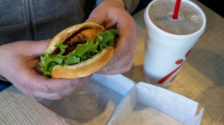 chick-fil-a chicken sandwich in customer hands