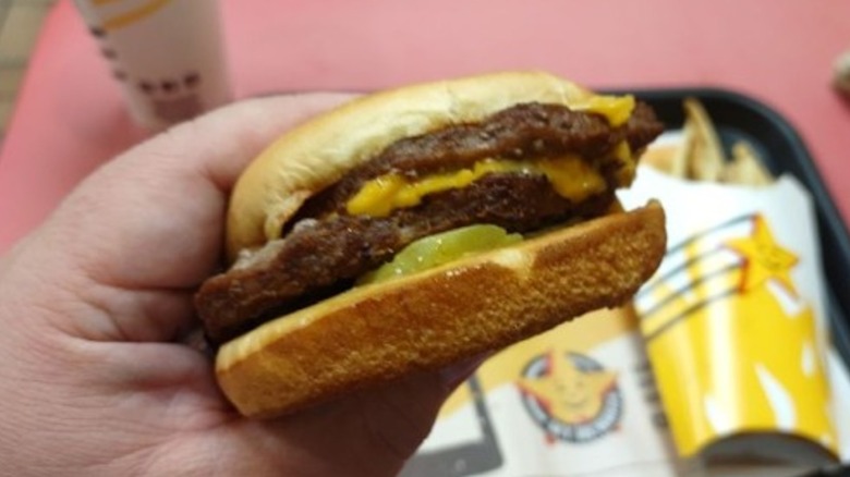 burger at carl's jr with fries and drink