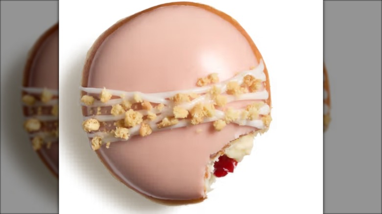 pink guava filled donut with bite