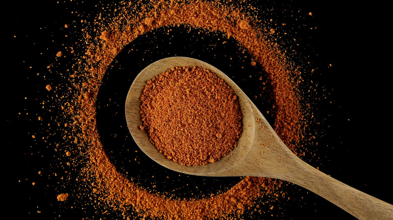 Mexican taco seasoning on a wooden spoon