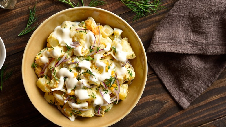 bowl of potato salad with eggs and dressing