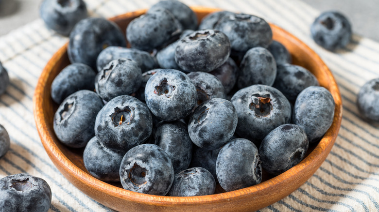 Blueberries in small wooden bowl