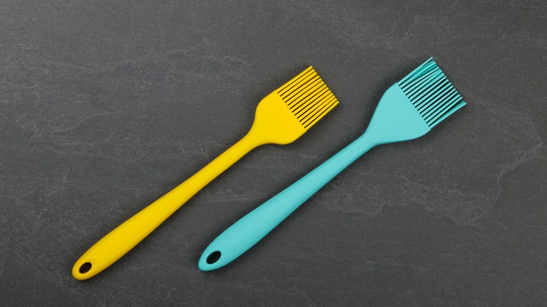 yellow and blue basting brushes