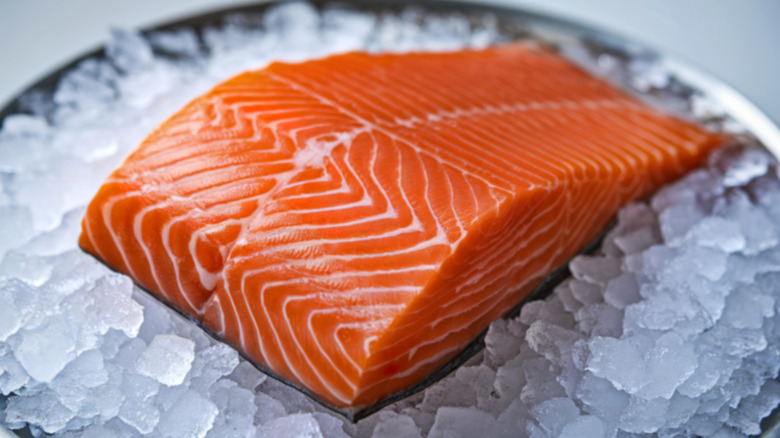 Two salmon steaks on a bowl of ice