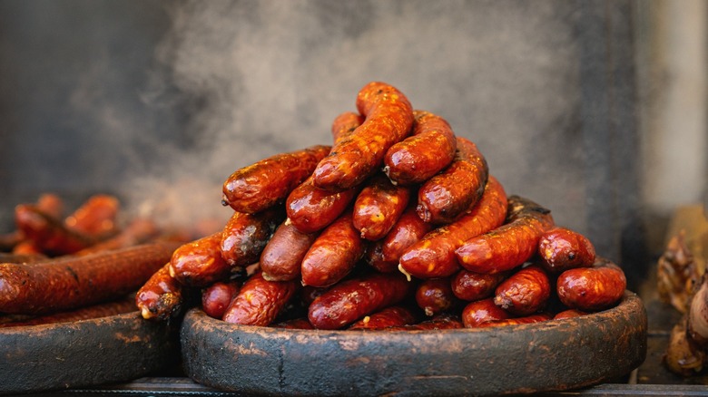 platters of smoked hot dogs on plates