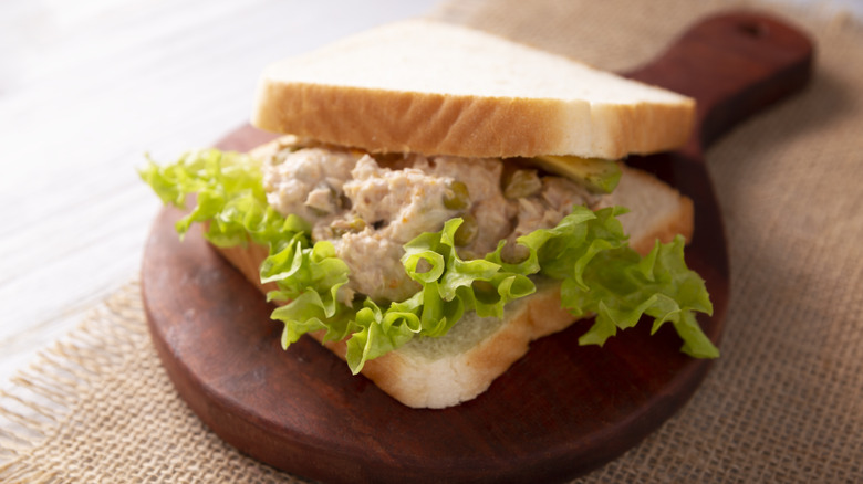 Tuna salad and lettuce in sandwich bread