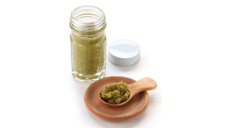 jar and spoonful of green yuzu kosho
