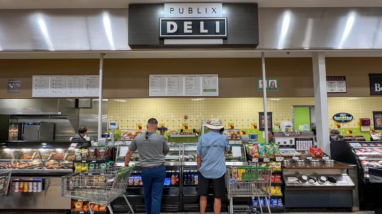 Shoppers standing in front of Publix deli counter