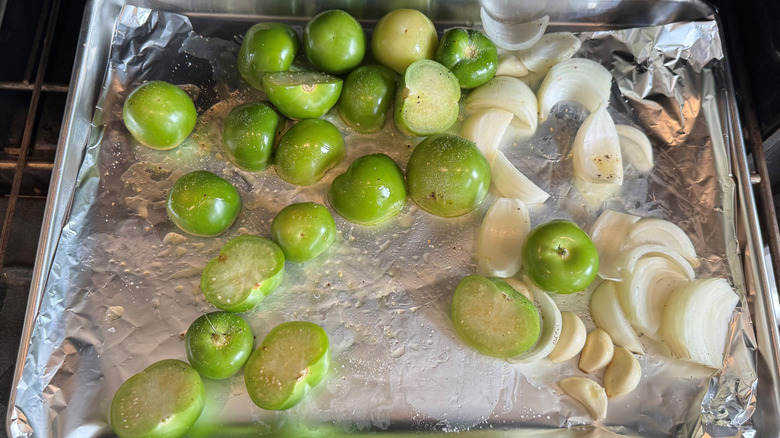 tomatillos, garlic, onion roasting in oven
