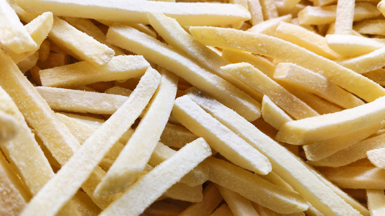 A close-up of frozen French fries