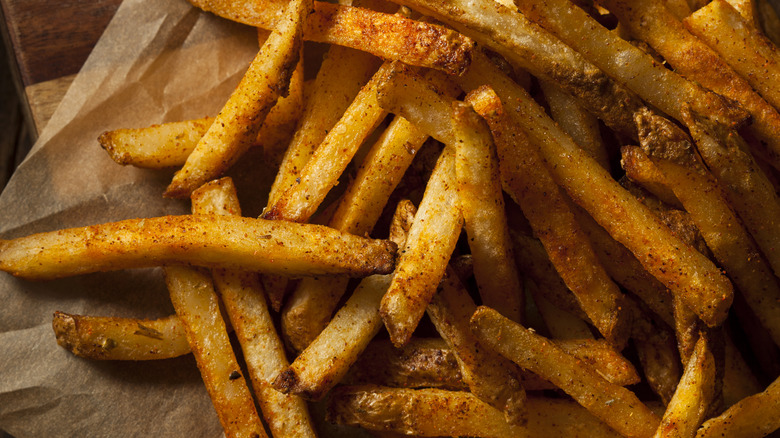 Close-up of seasoned French fries after cooking