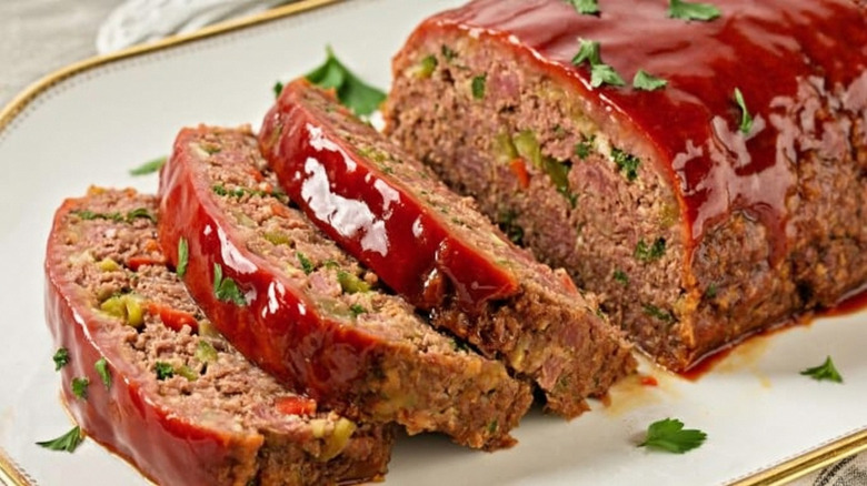 Sliced meatloaf with red ketchup glaze