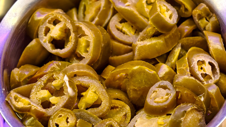 Close-up of jalapeño peppers in a metal container