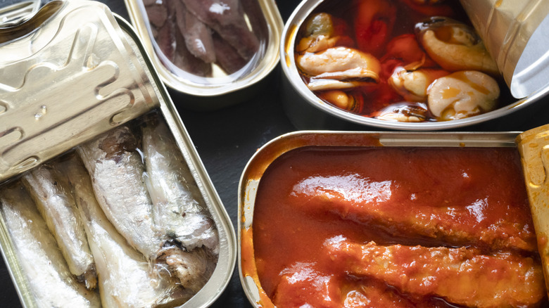 Various open cans of fish