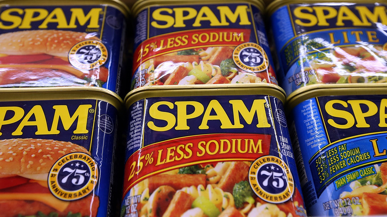 Cans of SPAM on a store shelf