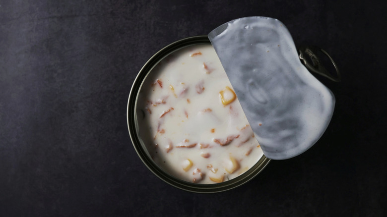 An opened can of creamy soup