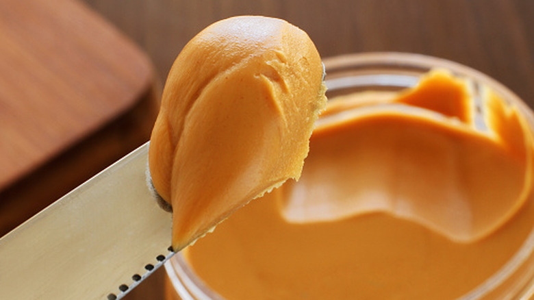 Close-up of peanut butter on a knife