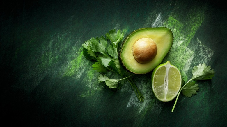 split avocado with lime and cilantro