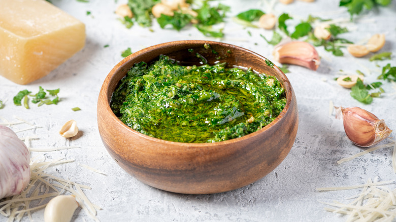Home-made pesto in a wooden bowl