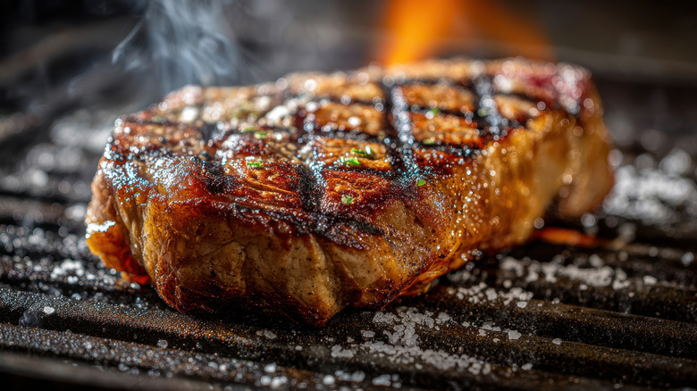 Closeup of steak on grill