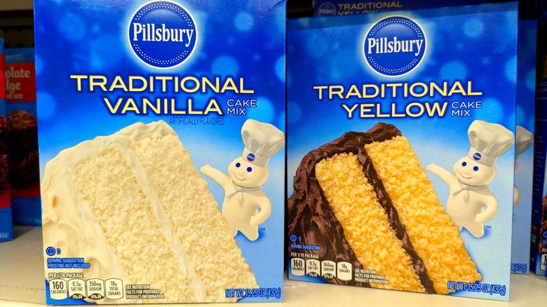 two boxes of pillsbury cake mix on store shelf