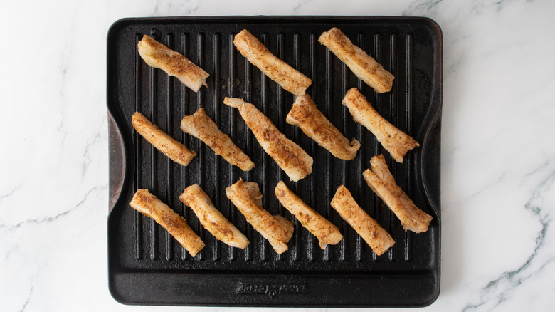 Fish strips on grill pan