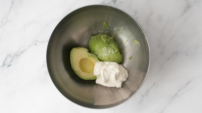 Avocado and sour cream in bowl