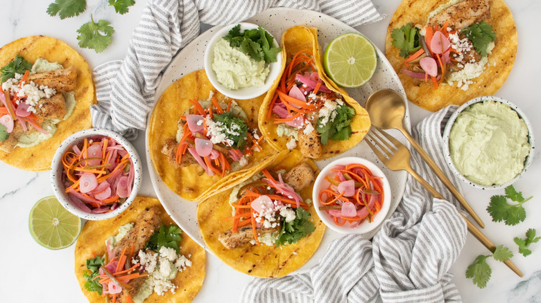 Grilled fish tacos with escabeche and limes