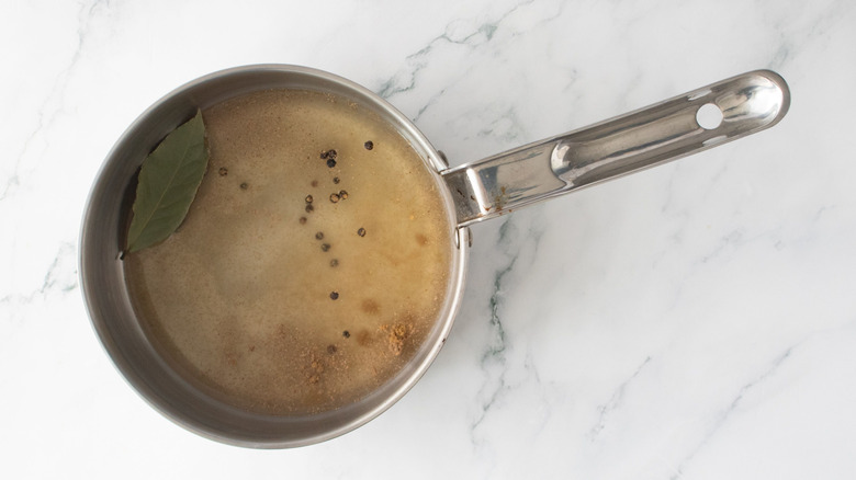 Pickling liquid and spices in saucepan