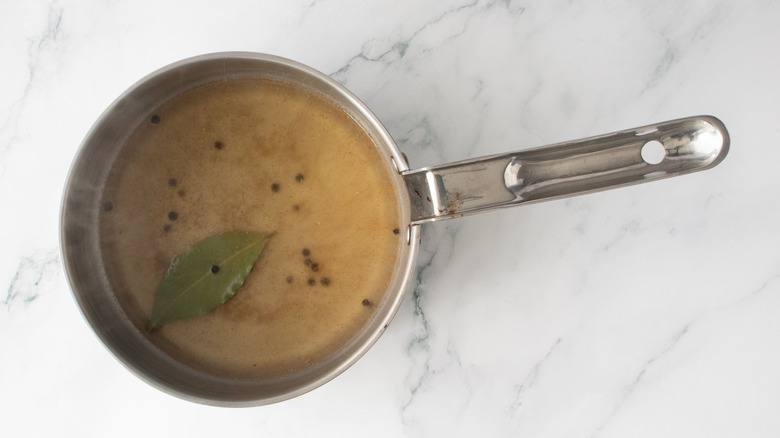 Pickling liquid and spices in saucepan